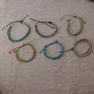 6 brand new not used Puravida bracelets